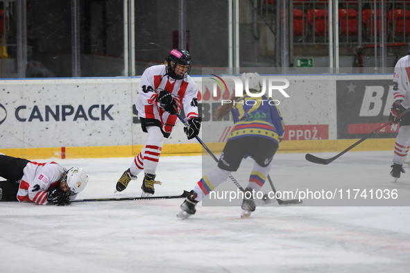 A hockey match takes place between KS Cracovia 1906 (reds) and MMKS Podhale Nowy Targ (blues) at the Adam 'Roch' Kowalski ice rink on the oc...