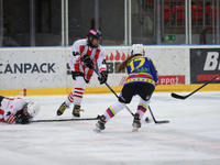 A hockey match takes place between KS Cracovia 1906 (reds) and MMKS Podhale Nowy Targ (blues) at the Adam 'Roch' Kowalski ice rink on the oc...