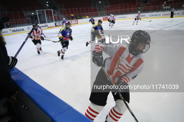 A hockey match takes place between KS Cracovia 1906 (reds) and MMKS Podhale Nowy Targ (blues) at the Adam 'Roch' Kowalski ice rink on the oc...