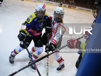 A hockey match takes place between KS Cracovia 1906 (reds) and MMKS Podhale Nowy Targ (blues) at the Adam 'Roch' Kowalski ice rink on the oc...