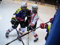 A hockey match takes place between KS Cracovia 1906 (reds) and MMKS Podhale Nowy Targ (blues) at the Adam 'Roch' Kowalski ice rink on the oc...