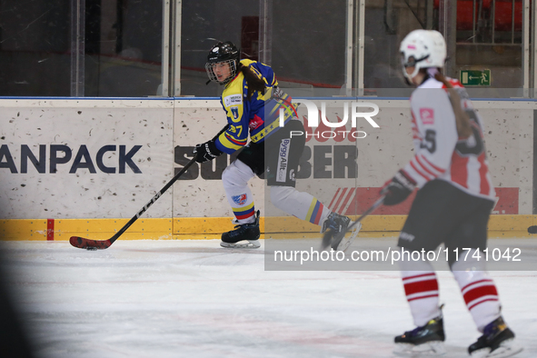 A hockey match takes place between KS Cracovia 1906 (reds) and MMKS Podhale Nowy Targ (blues) at the Adam 'Roch' Kowalski ice rink on the oc...