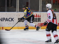 A hockey match takes place between KS Cracovia 1906 (reds) and MMKS Podhale Nowy Targ (blues) at the Adam 'Roch' Kowalski ice rink on the oc...