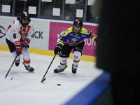 A hockey match takes place between KS Cracovia 1906 (reds) and MMKS Podhale Nowy Targ (blues) at the Adam 'Roch' Kowalski ice rink on the oc...