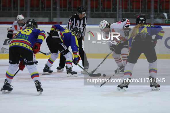 A hockey match takes place between KS Cracovia 1906 (reds) and MMKS Podhale Nowy Targ (blues) at the Adam 'Roch' Kowalski ice rink on the oc...