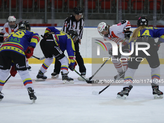 A hockey match takes place between KS Cracovia 1906 (reds) and MMKS Podhale Nowy Targ (blues) at the Adam 'Roch' Kowalski ice rink on the oc...