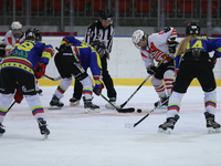 A hockey match takes place between KS Cracovia 1906 (reds) and MMKS Podhale Nowy Targ (blues) at the Adam 'Roch' Kowalski ice rink on the oc...