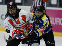 A hockey match takes place between KS Cracovia 1906 (reds) and MMKS Podhale Nowy Targ (blues) at the Adam 'Roch' Kowalski ice rink on the oc...