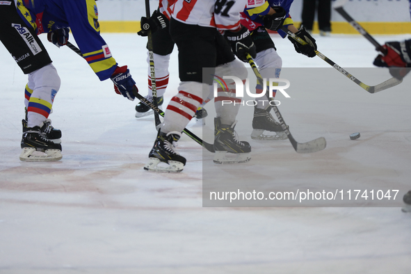 A hockey match takes place between KS Cracovia 1906 (reds) and MMKS Podhale Nowy Targ (blues) at the Adam 'Roch' Kowalski ice rink on the oc...