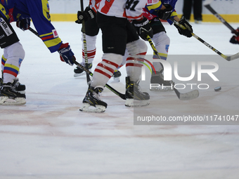 A hockey match takes place between KS Cracovia 1906 (reds) and MMKS Podhale Nowy Targ (blues) at the Adam 'Roch' Kowalski ice rink on the oc...