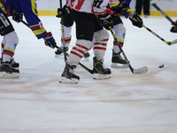 A hockey match takes place between KS Cracovia 1906 (reds) and MMKS Podhale Nowy Targ (blues) at the Adam 'Roch' Kowalski ice rink on the oc...