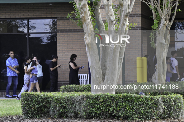 Residents of Orange County in Central Florida participate in early voting for the US presidential elections on December 3. 