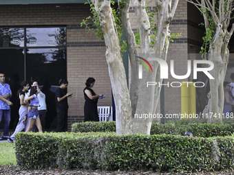 Residents of Orange County in Central Florida participate in early voting for the US presidential elections on December 3. (