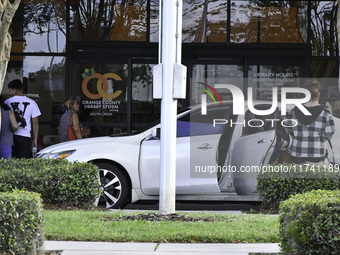 Residents of Orange County in Central Florida participate in early voting for the US presidential elections on December 3. (