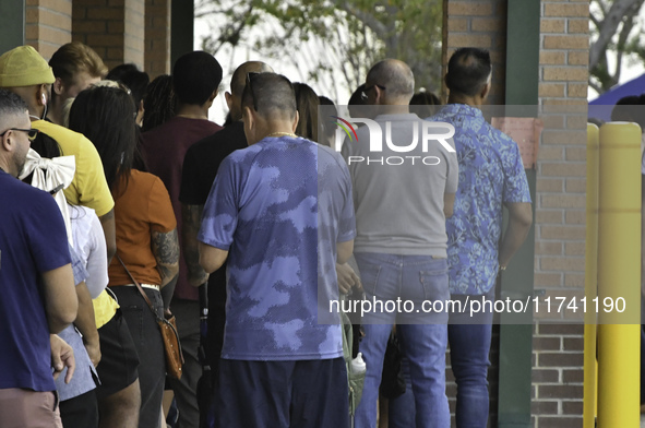 Residents of Orange County in Central Florida participate in early voting for the US presidential elections on December 3. 