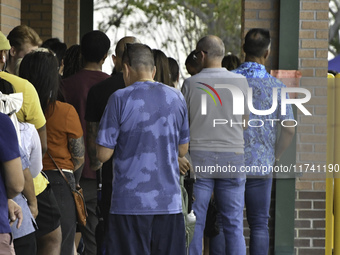 Residents of Orange County in Central Florida participate in early voting for the US presidential elections on December 3. (