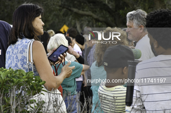 Residents of Orange County in Central Florida participate in early voting for the US presidential elections on December 3. 