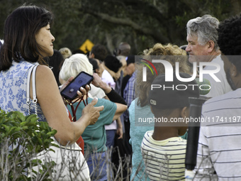 Residents of Orange County in Central Florida participate in early voting for the US presidential elections on December 3. (