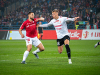 Lukasz Zwolinski and Jakub Budnicki participate in the game between Wisla Krakow and GKS Tychy in Krakow, Poland, on November 4, 2024. This...