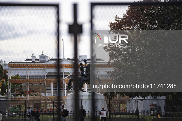 On November 4, 2024, in Washington, DC, a day before election day, the Secret Service and businesses board up the front of buildings and pla...