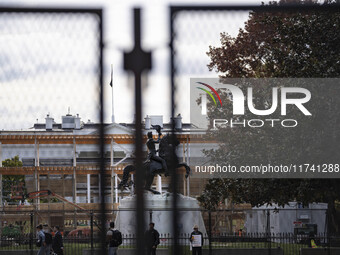 On November 4, 2024, in Washington, DC, a day before election day, the Secret Service and businesses board up the front of buildings and pla...