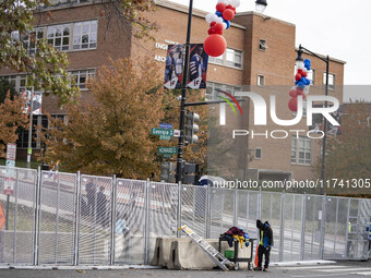 Crews outside Howard University in Washington, DC, on November 4, 2024, put up fencing where Vice President Kamala Harris will have a watch...