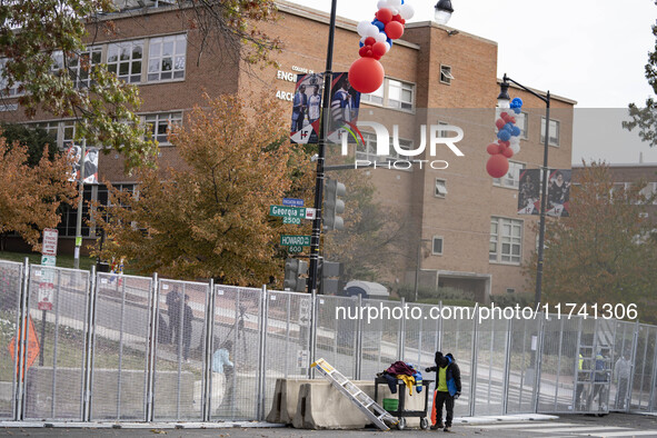 Crews outside Howard University in Washington, DC, on November 4, 2024, put up fencing where Vice President Kamala Harris will have a watch...