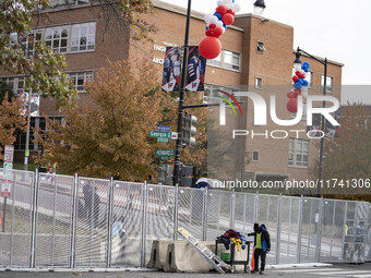 Crews outside Howard University in Washington, DC, on November 4, 2024, put up fencing where Vice President Kamala Harris will have a watch...