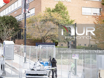 Crews outside Howard University in Washington, DC, on November 4, 2024, put up fencing where Vice President Kamala Harris will have a watch...