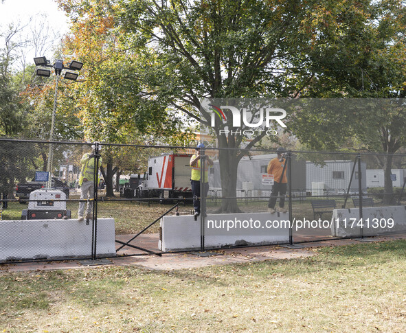 Crews outside the White House in Washington, DC, on November 4, 2024, reinforce the fence as a safety precaution. 