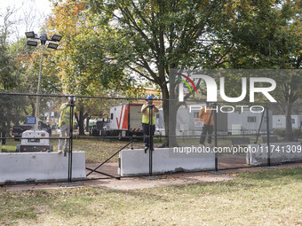 Crews outside the White House in Washington, DC, on November 4, 2024, reinforce the fence as a safety precaution. (