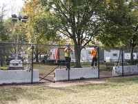 Crews outside the White House in Washington, DC, on November 4, 2024, reinforce the fence as a safety precaution. (