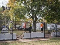 Crews outside the White House in Washington, DC, on November 4, 2024, reinforce the fence as a safety precaution. (