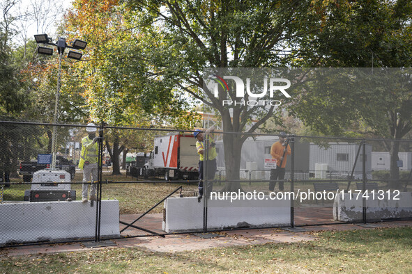 Crews outside the White House in Washington, DC, on November 4, 2024, reinforce the fence as a safety precaution. 