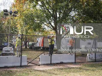 Crews outside the White House in Washington, DC, on November 4, 2024, reinforce the fence as a safety precaution. (