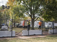 Crews outside the White House in Washington, DC, on November 4, 2024, reinforce the fence as a safety precaution. (