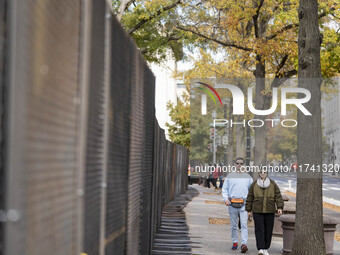 On November 4, 2024, in Washington, DC, a day before election day, the Secret Service and businesses board up the front of buildings and pla...