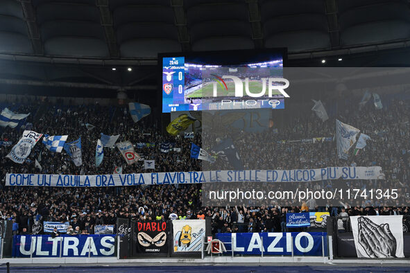 Supporters of S.S. Lazio are in action during the 11th day of the Serie A Championship between S.S. Lazio and Cagliari Calcio at the Olympic...