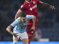 Omar Alderete of Getafe CF competes for the ball with Iago Aspas of RC Celta de Vigo during the La Liga EA Sports match between RC Celta de...