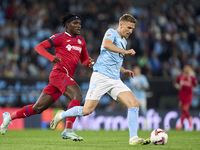 Carl Starfelt of RC Celta de Vigo is challenged by Christantus Uche of Getafe CF during the La Liga EA Sports match between RC Celta de Vigo...