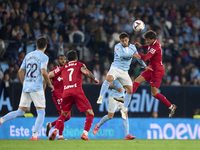 Fran Beltran of RC Celta de Vigo competes for the ball with Luis Milla of Getafe CF during the La Liga EA Sports match between RC Celta de V...