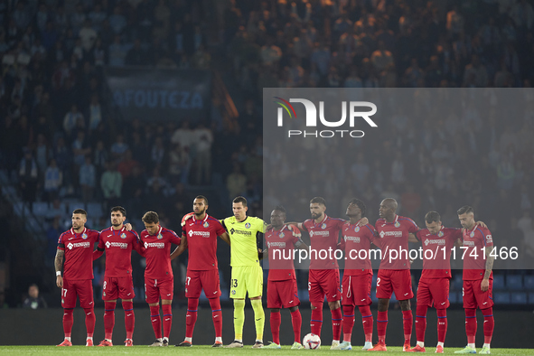 Players of Getafe CF pause for a moment of silence to pay their respects to the victims of the flooding disaster in Spain before the La Liga...