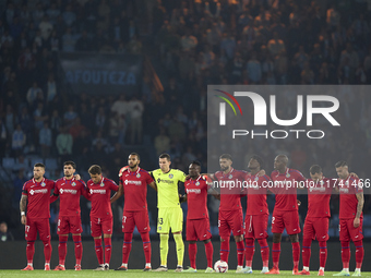 Players of Getafe CF pause for a moment of silence to pay their respects to the victims of the flooding disaster in Spain before the La Liga...