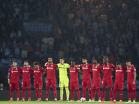 Players of Getafe CF pause for a moment of silence to pay their respects to the victims of the flooding disaster in Spain before the La Liga...