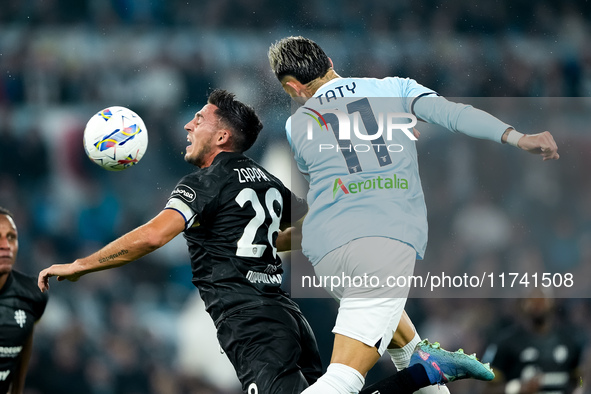 Gabriele Zappa of Cagliari Calcio and Taty Castellanos of SS Lazio jump for the ball during the Serie A Enilive match between SS Lazio and C...