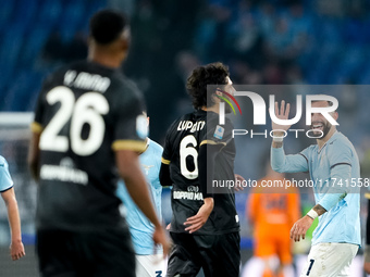 Taty Castellanos of SS Lazio greets Mina as he leaves the pitch receiving a red card during the Serie A Enilive match between SS Lazio and C...