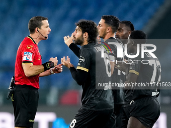 Players of Cagliari Calcio protest with the referee Nicola Ayroldi during the Serie A Enilive match between SS Lazio and Cagliari Calcio at...