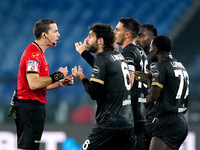 Players of Cagliari Calcio protest with the referee Nicola Ayroldi during the Serie A Enilive match between SS Lazio and Cagliari Calcio at...