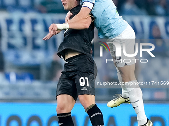 Roberto Piccoli of Cagliari Calcio and Alessio Romagnoli of SS Lazio jump for the ball during the Serie A Enilive match between SS Lazio and...