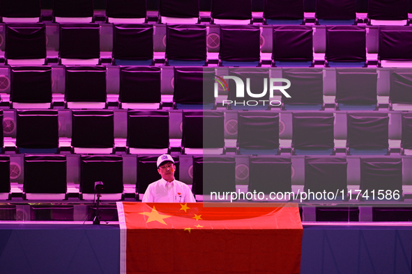 RIYADH, SAUDI ARABIA - NOVEMBER 04: A Chinese fan awaits Qinwen Zheng's match against Elena Rybakina of Kazakhstan on Day 3 of the 2024 WTA...